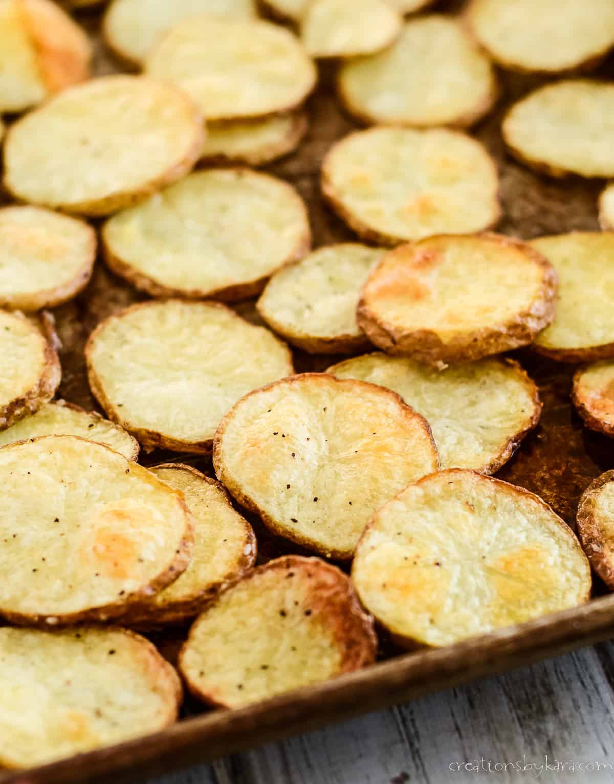 pan of crisp baked potato slices