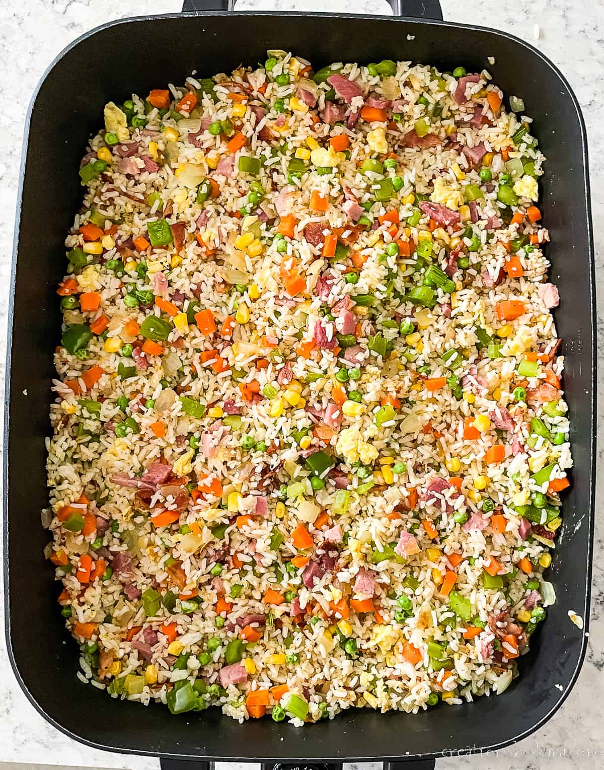 skillet of fried rice with ham