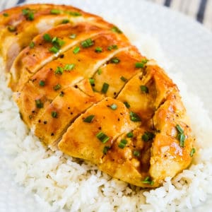 honey mustard baked chicken on a plate with white rice