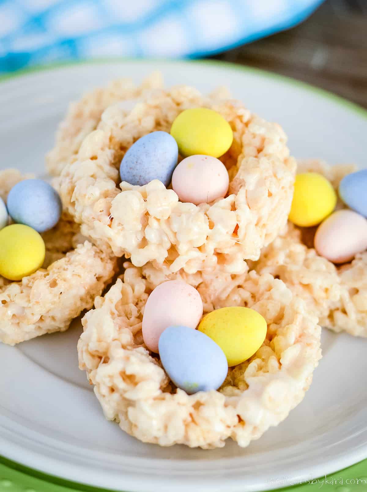 plate of rice krispie nests filled with mini cadbury eggs