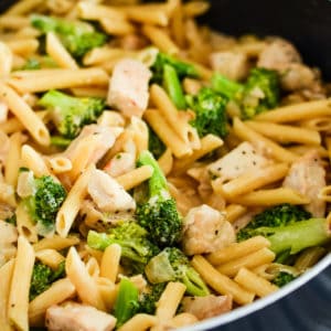 skillet of creamy pasta with chicken and broccoli