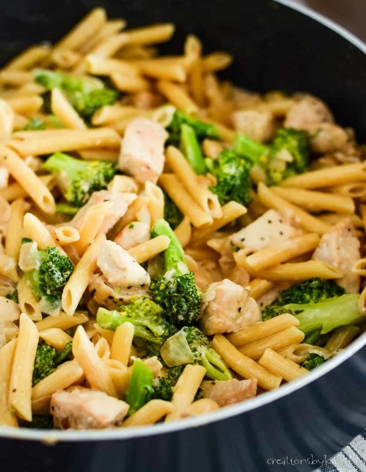 skillet of creamy pasta with chicken and broccoli