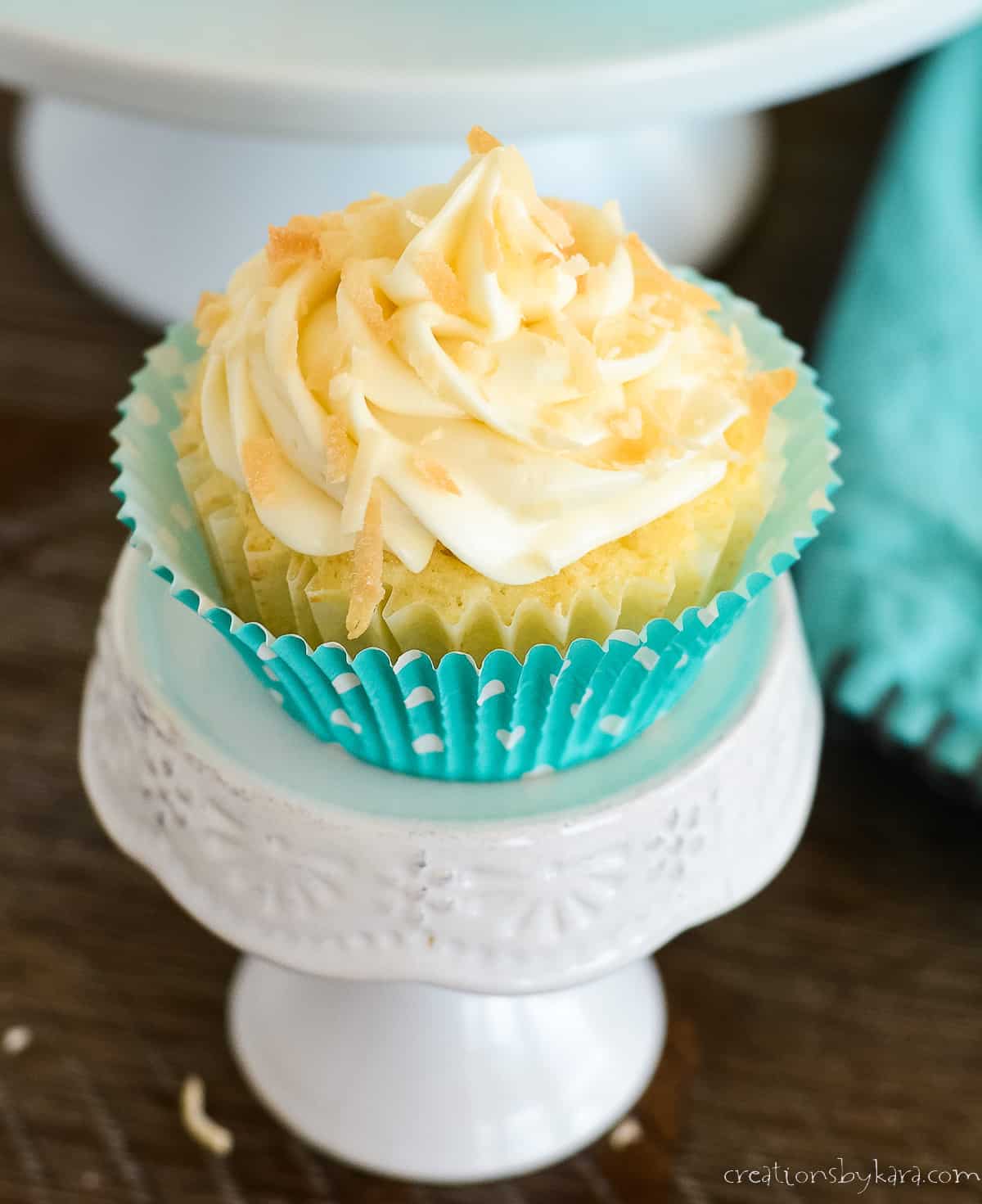 frosted cupcake sprinkled with toasted coconut