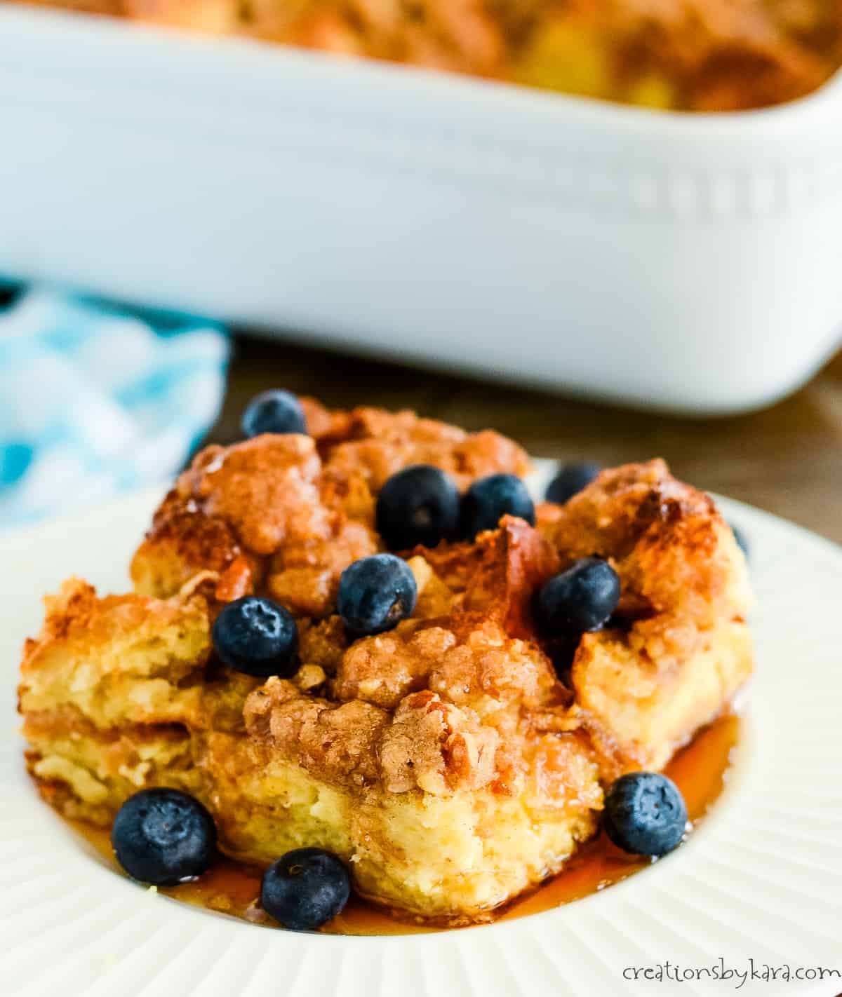overnight french toast bake with blueberries and maple syrup