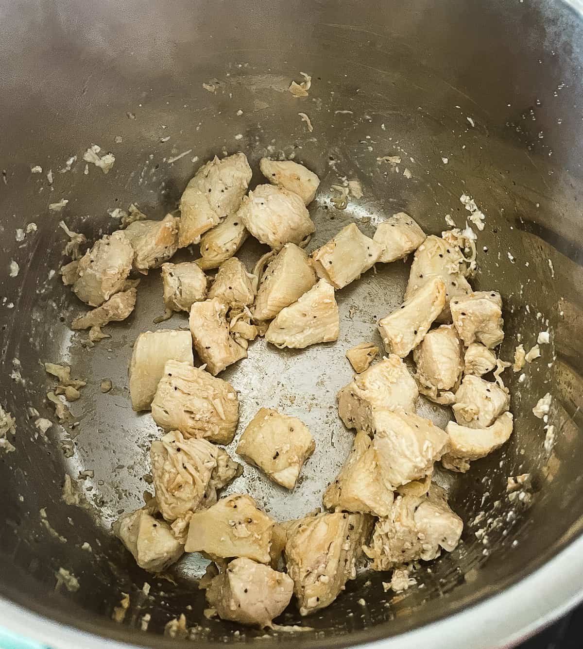 chicken chunks browning in an instant pot