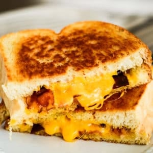 grilled cheese with bacon, cut in half