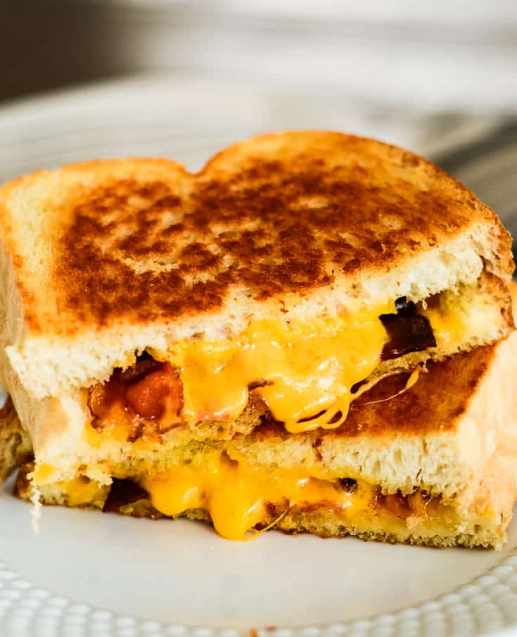grilled cheese with bacon, cut in half