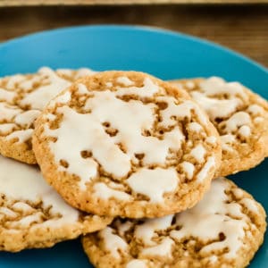 blue plate of iced oatmeal cookies