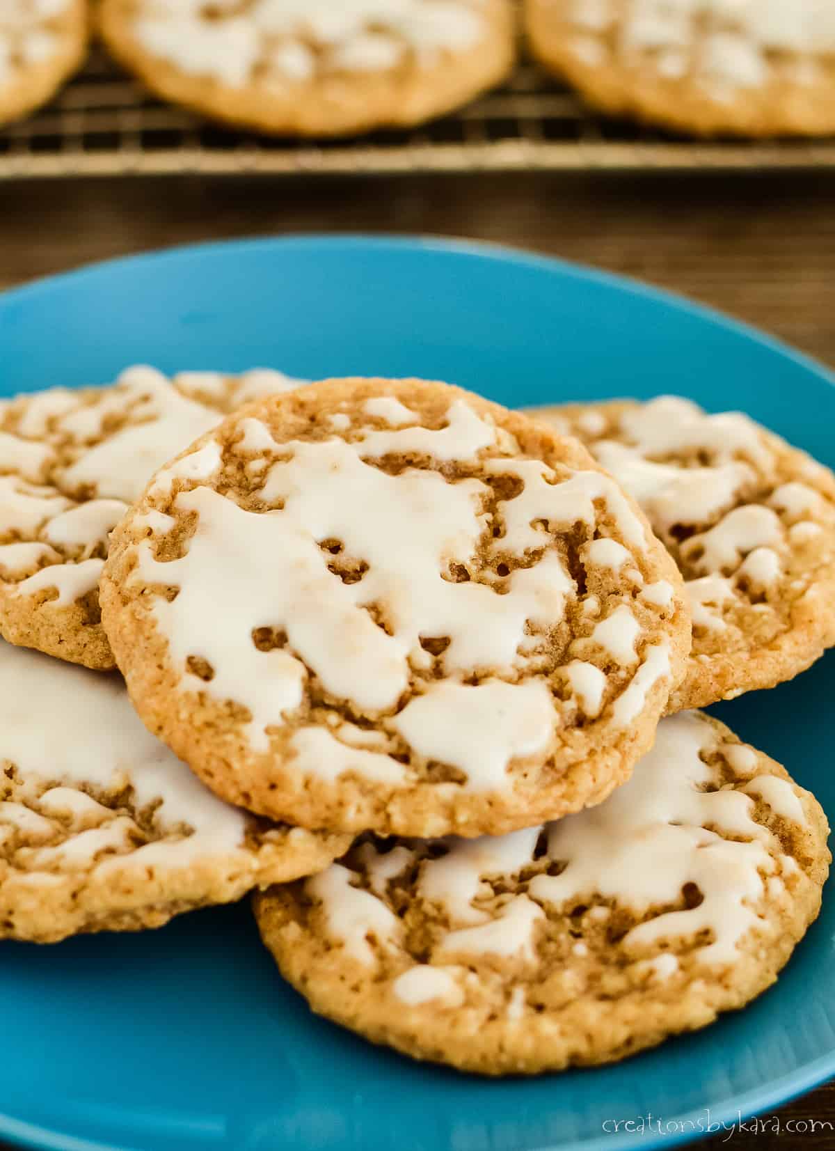 blue plate of iced oatmeal cookies