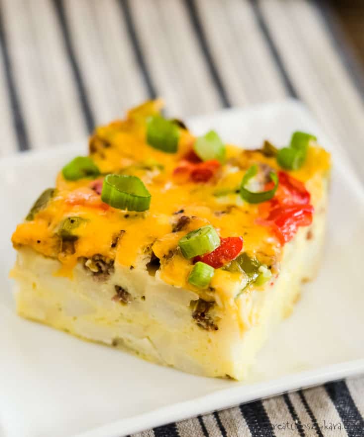 square of sausage hash brown breakfast casserole on a white plate