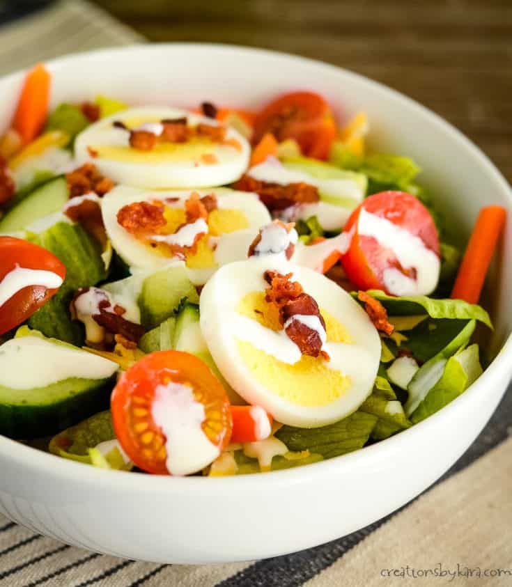 bowl of side salad with ranch dressing