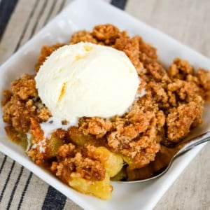brown apple betty with a scoop of vanilla ice cream