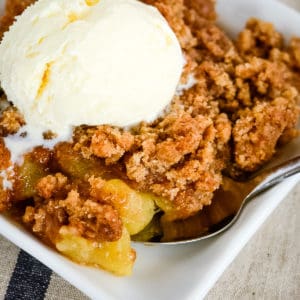 plate of apple betty with a spoon