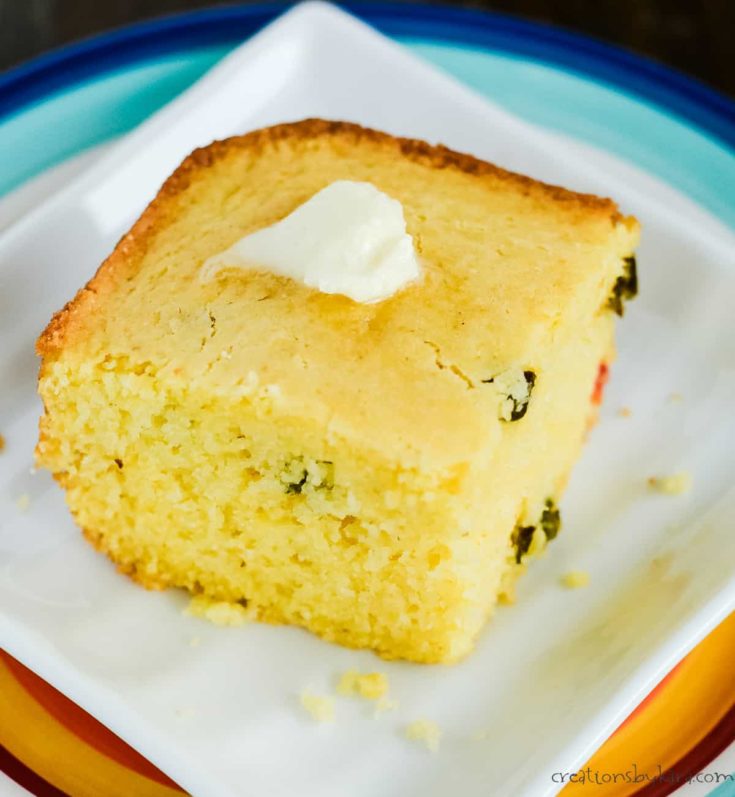 close up of slice of cornbread with jalapenos