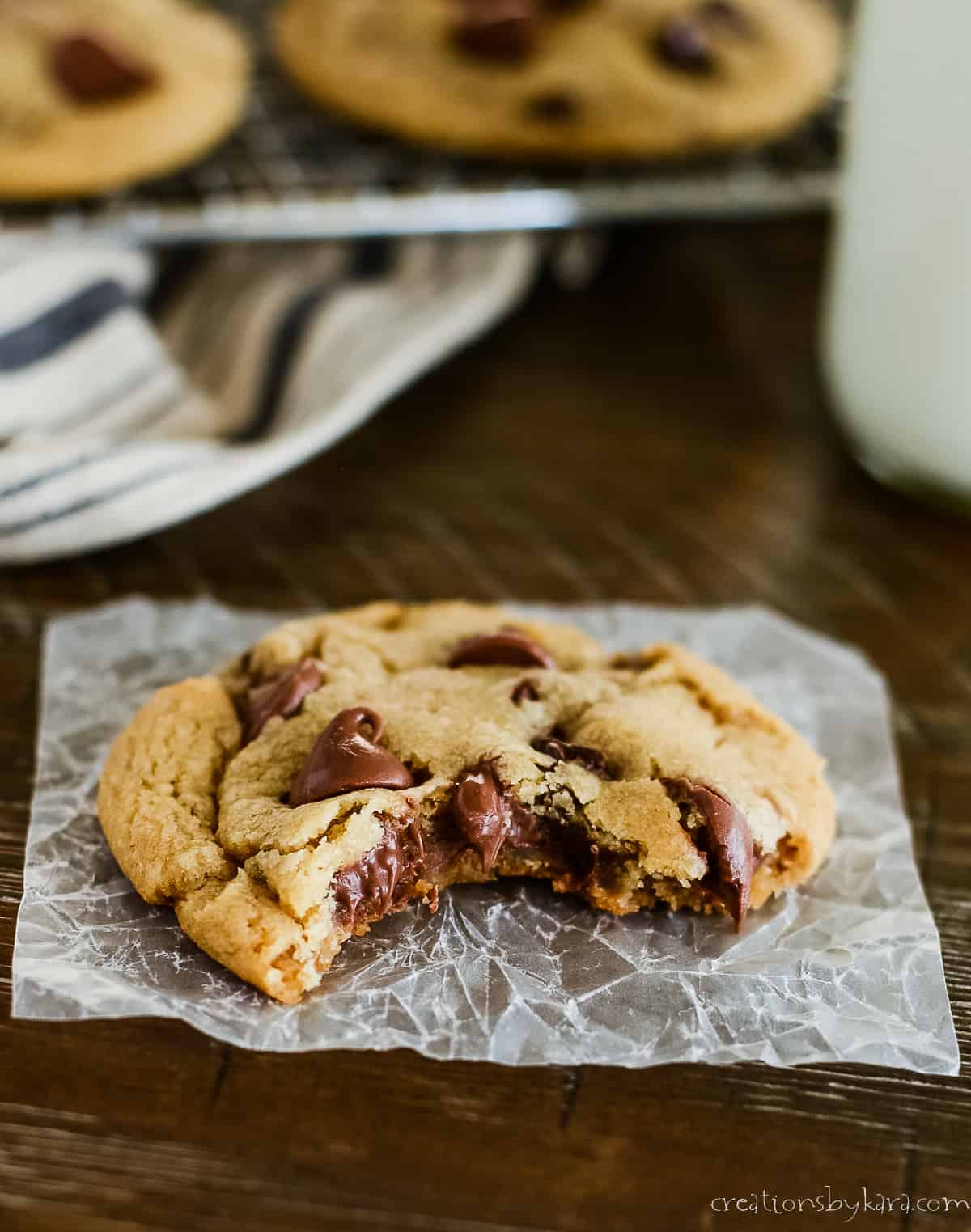 brown butter chocolate chip cookie with a bite taken out of it