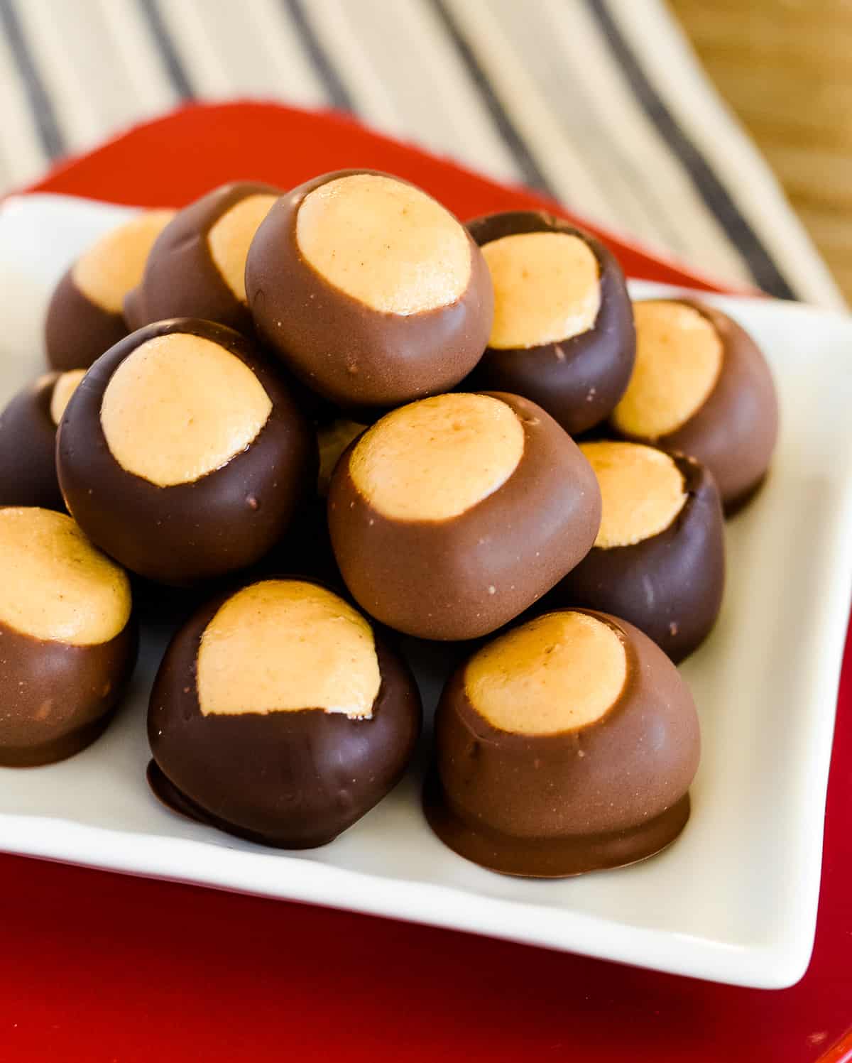 stack of buckeye peanut butter balls on a white plate