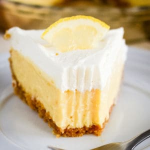 close up of lemon icebox pie with a bite taken out of it