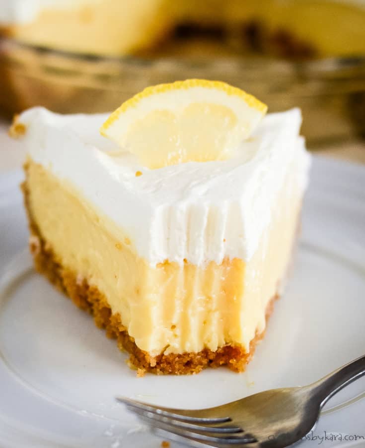 close up of lemon icebox pie with a bite taken out of it