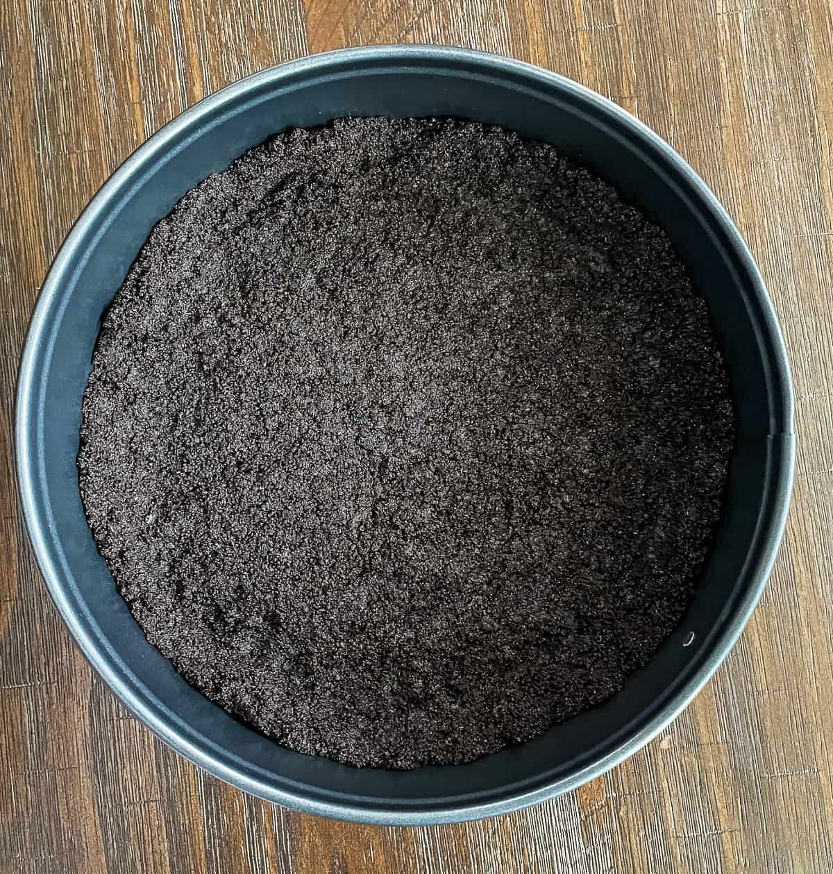 chocolate cookie crust in a springform pan