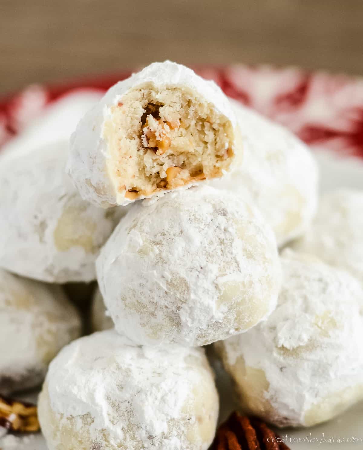 cookie filled with chopped pecans and rolled in powdered sugar
