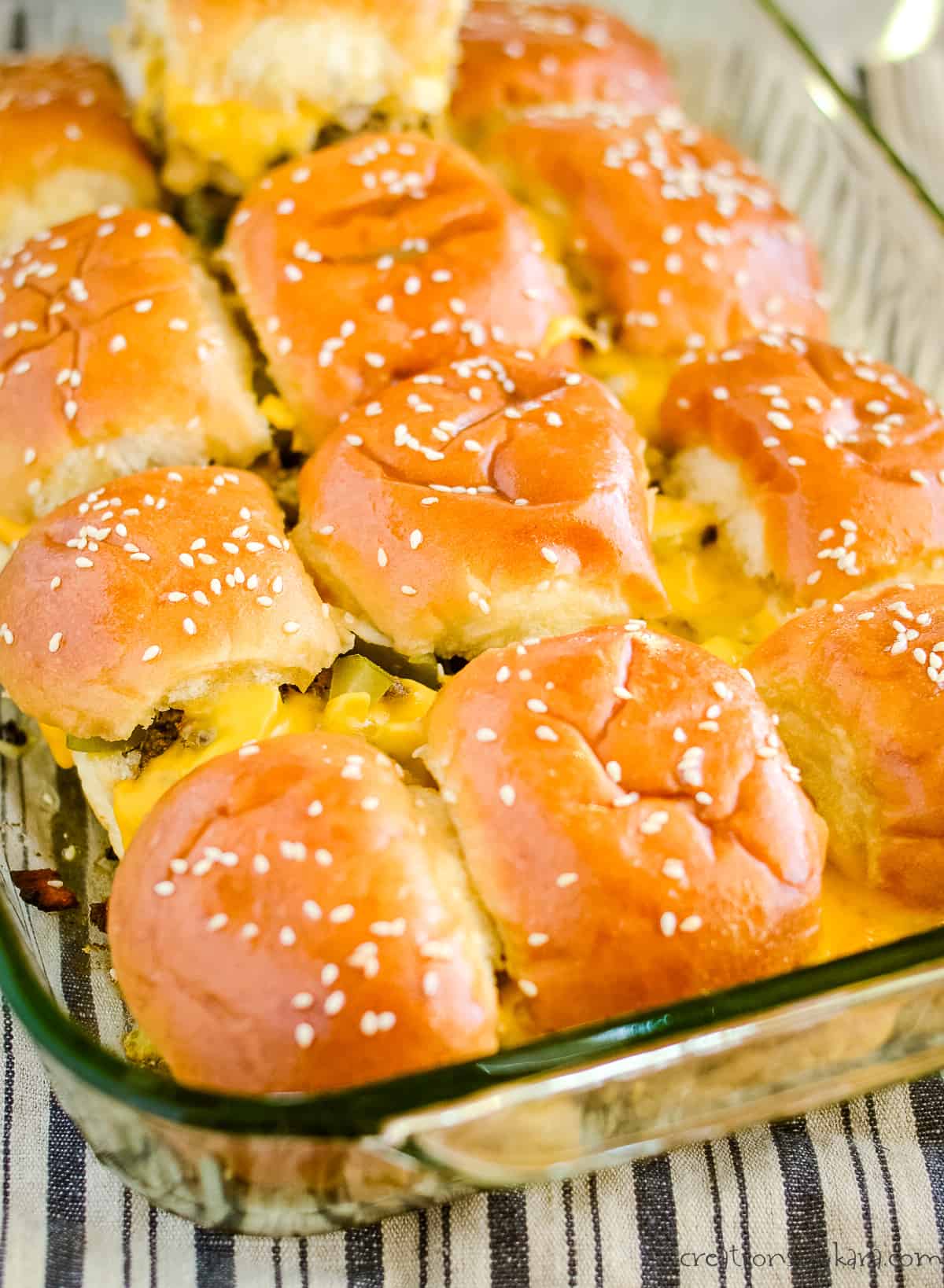 pan of baked hawaiian roll cheeseburger sliders