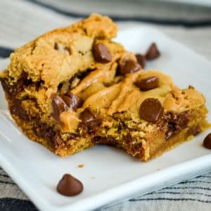 chocolate chip peanut butter bar with a bite taken out of it