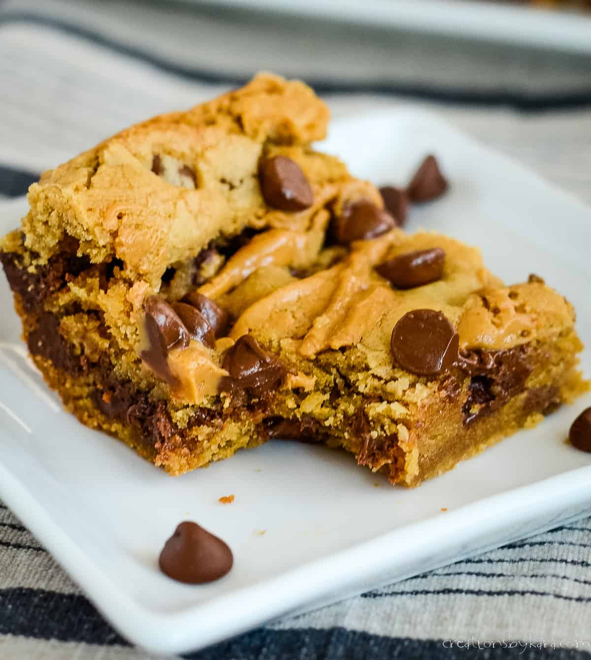 chocolate chip peanut butter bar with a bite taken out of it