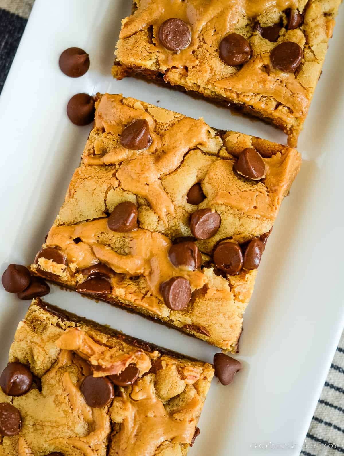 overhead shot of chocolate chip peanut butter bars on a tray