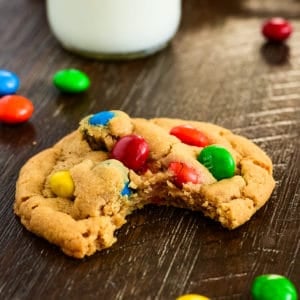 peanut butter M&M cookie with a bite taken out of it