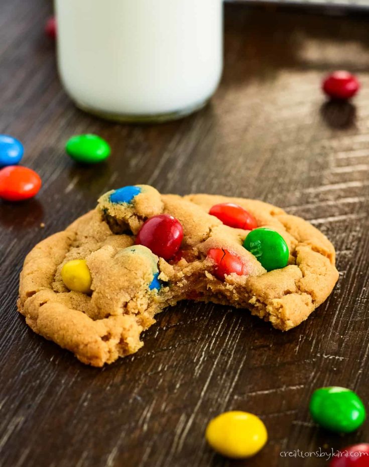 peanut butter M&M cookie with a bite taken out of it