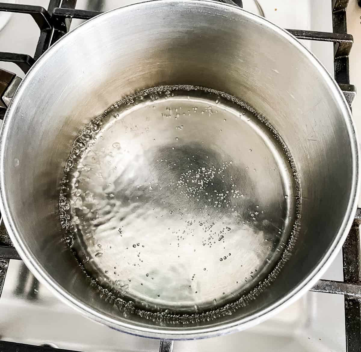 small amount of water boiling in a saucepan