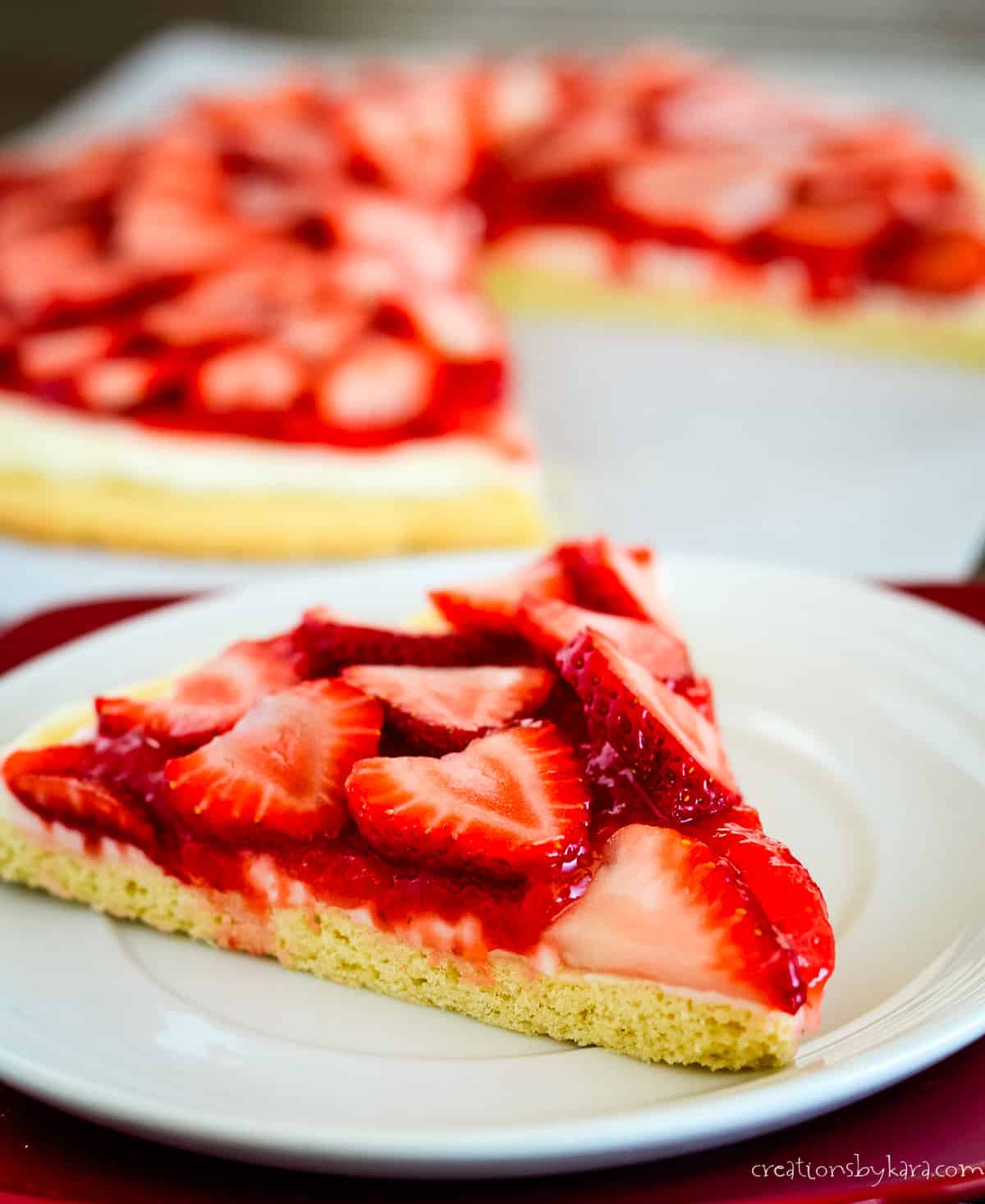 slice of sugar cookie crust strawberry pizza
