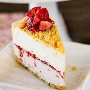 slice of lemon strawberry ice cream cake garnished with fresh strawberries