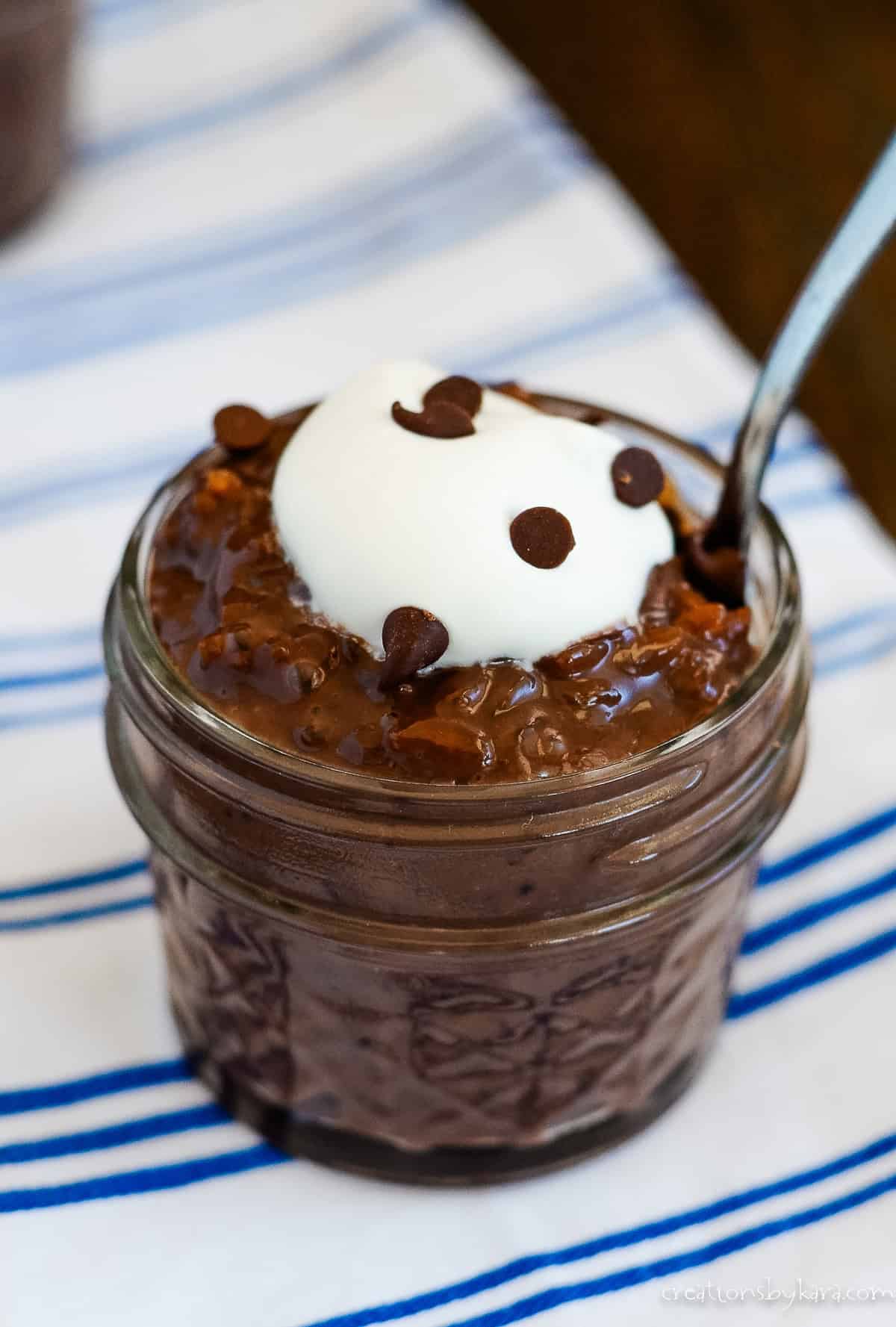 chocolate rice pudding with whipped cream and chocolate chips