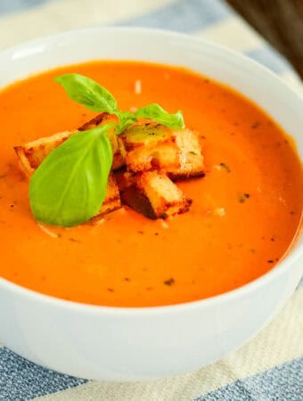 bowl of creamy tomato basil soup with croutons