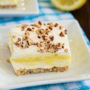 slice of lemon lush dessert on a plate