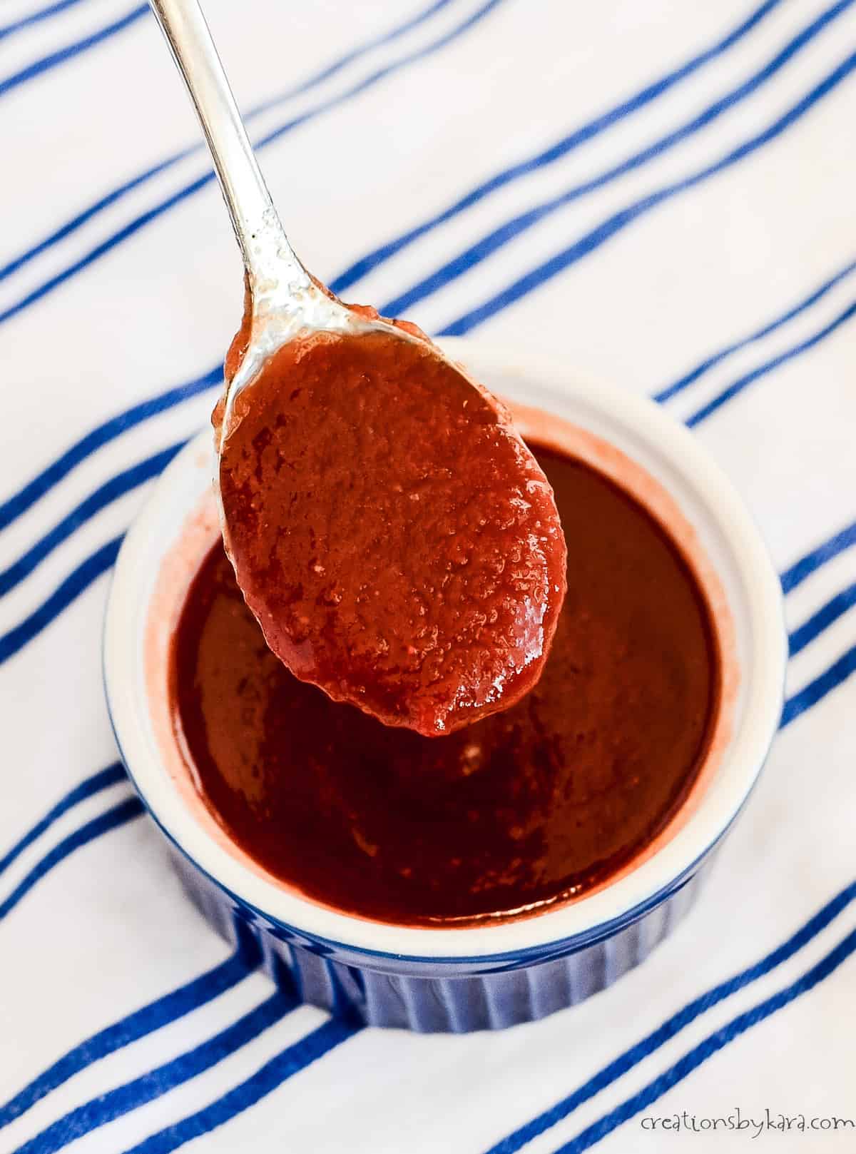 spoonful of homemade chili sauce over a bowl