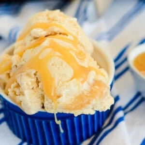 bowl of homemade salted caramel ice cream drizzled with caramel