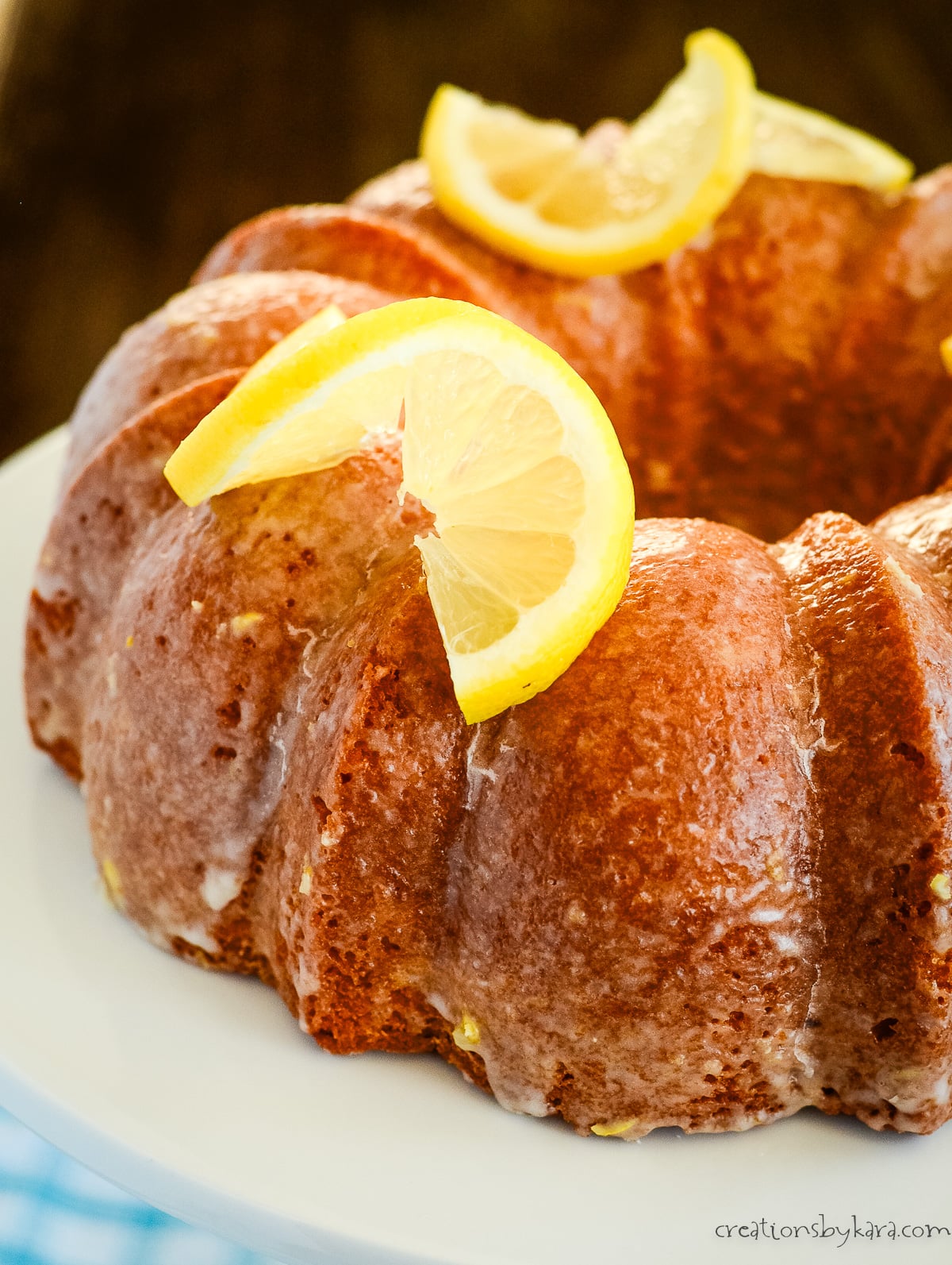 lemon pudding pound cake garnished with lemon slices