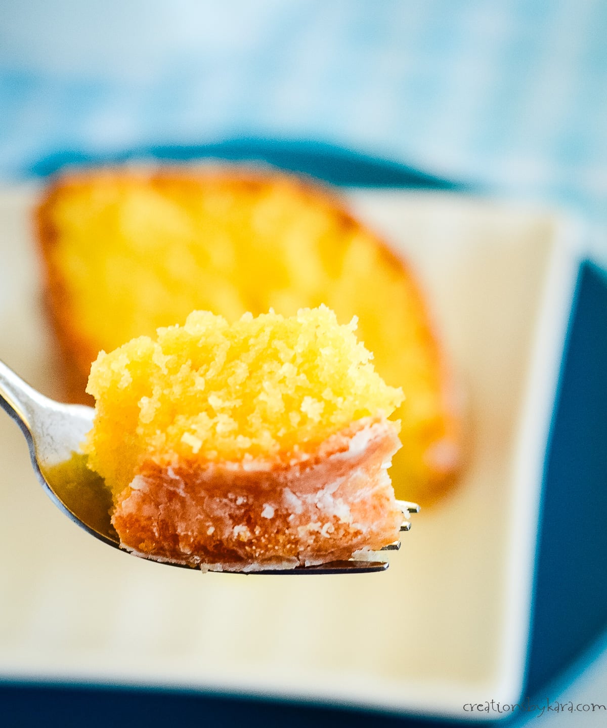 bite of lemon pudding pound cake o a fork