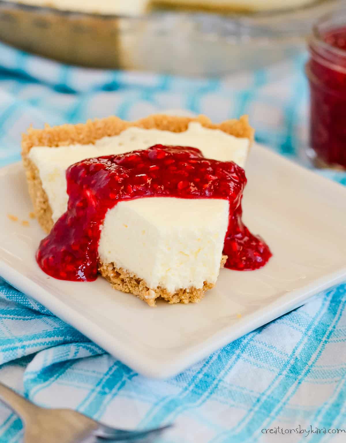 cream cheese pie on a plate with a bite taken out of it