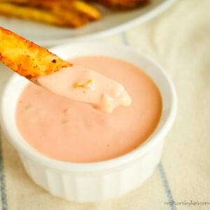 fry being dipped into a bowl of homemade in-n-out sauce