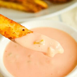 bowl of homemade in-n-out burger sauce with a fry dipped in it