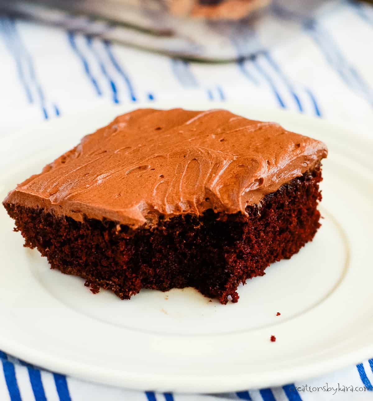 plate with a slice of frosted chocolate mayo cake