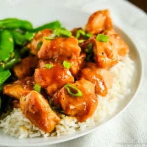 creamy peanut butter chicken over a bed of rice