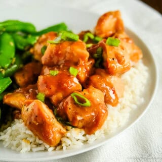 creamy peanut butter chicken over a bed of rice