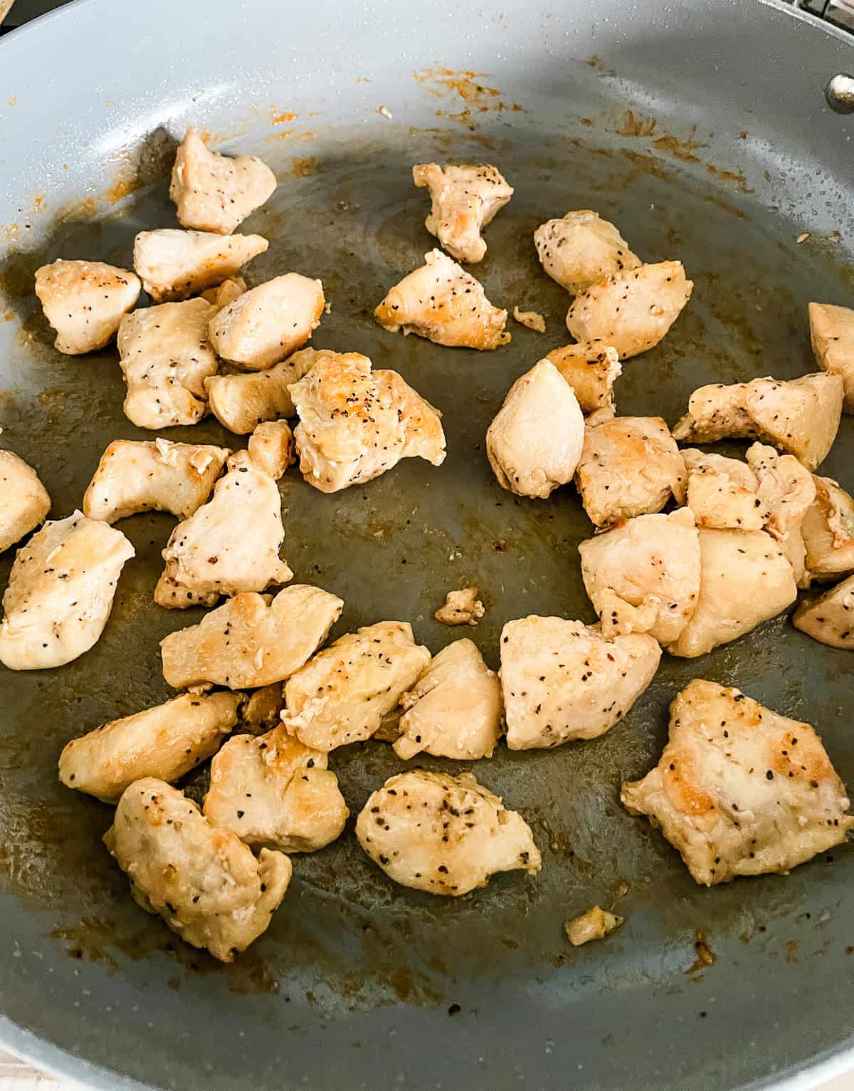 sauteed chicken chunks in a skillet