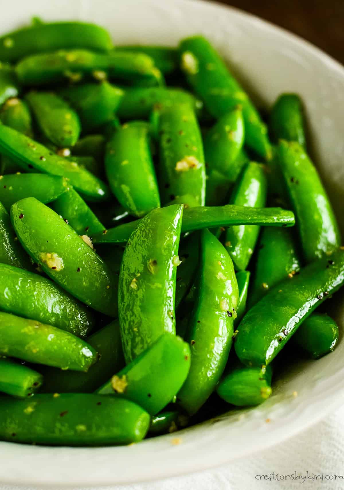 bowl of sugar snap peas sauteed with garlic