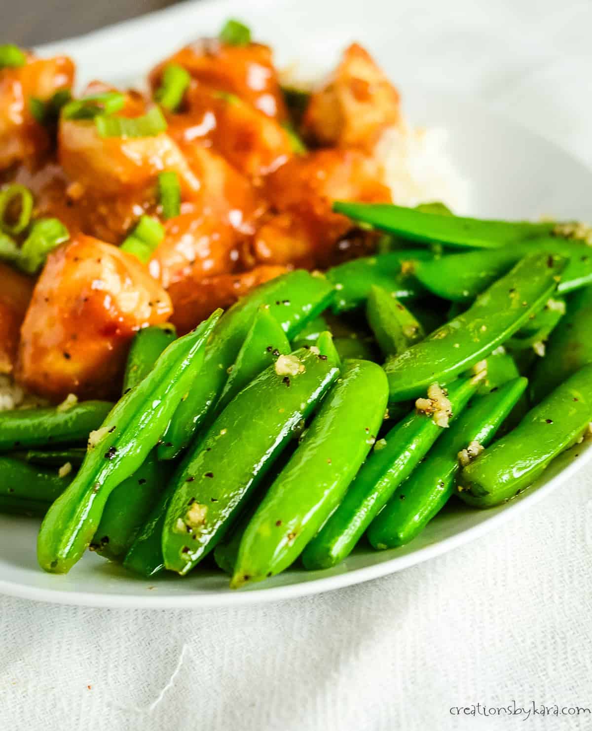 peanut butter chicken with sauteed sugar snap peas