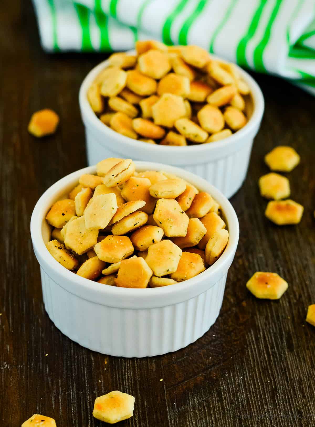 two white bowls filled with spiced oyster crackers